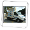 Casa din lemn transportata pe componente pe camion mic