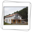 Casa cu peretii din panouri premontate tip osatura-platforma sau timber frame - vedere exterioara